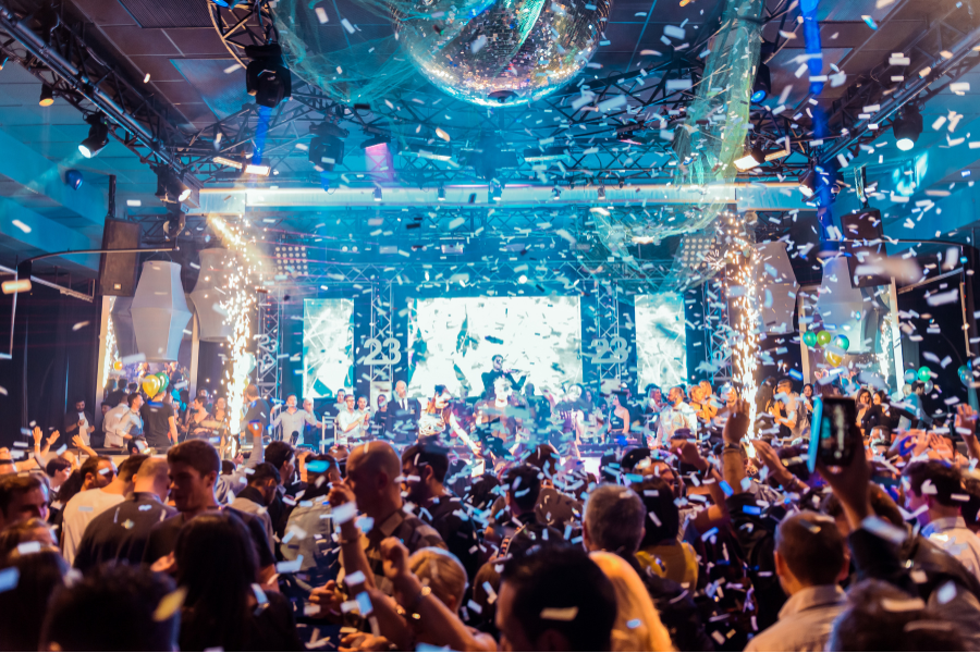 Company Holiday Party Venue in Kansas City: What to Look For 3 Crowded company holiday party venue with live entertainment, confetti and disco ball