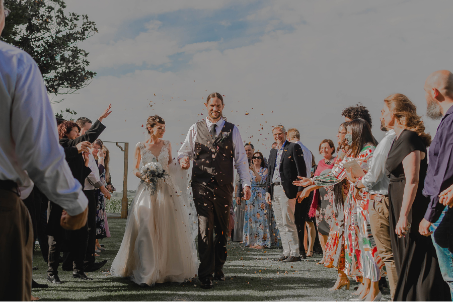 couples walking in to the ceremony spot outdoor wedding 