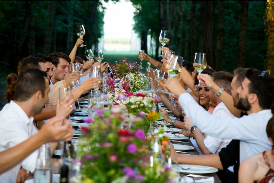 How to Plan an Outdoor Wedding Reception Layout: Ceremony, Cocktail Hour, Dinner & Backup Space 3 guests celebrating the wedding