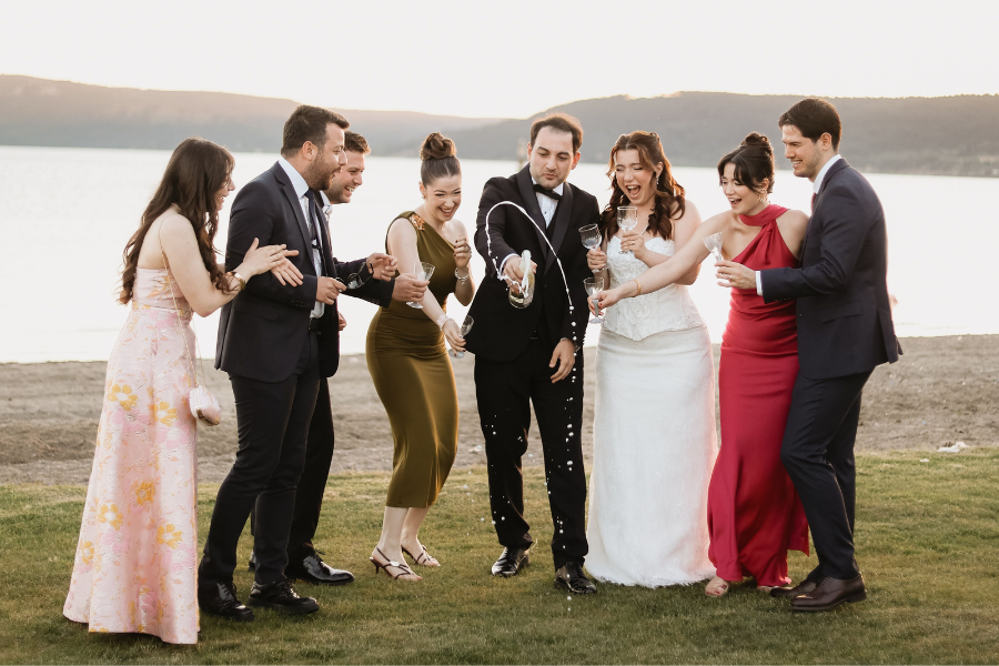 Lakeside Wedding Venue Checklist: Weather, Access, Sound, Lighting & Guest Comfort 2 wedding guests enjoying near lakeside