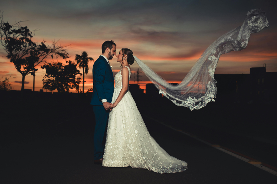 couples looking at each other with a sunset in background 